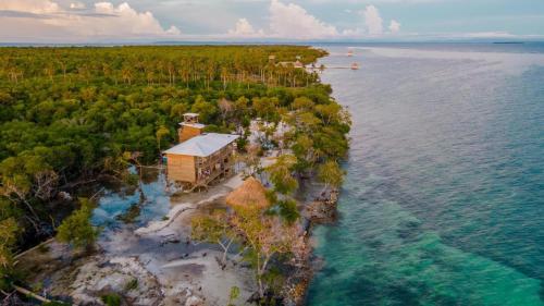 an aerial view of a house on an island in the water at Villa Luz Coastal Sanctuary in Tintipan Island