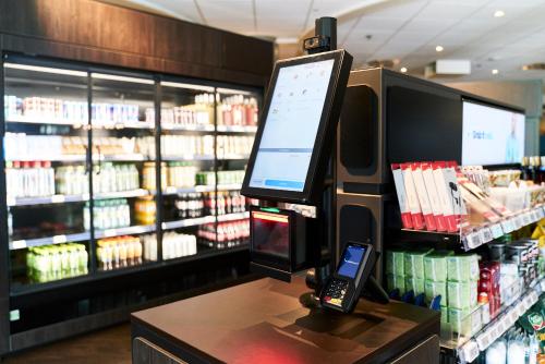 a computer monitor on a counter in a grocery store at Radisson Blu Hotel Dortmund in Dortmund