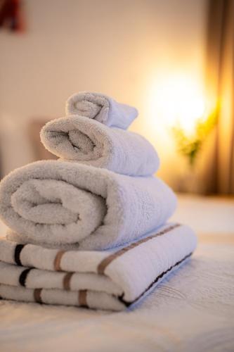 a stack of towels stacked on top of each other at Casa Leonore II in Willemstad