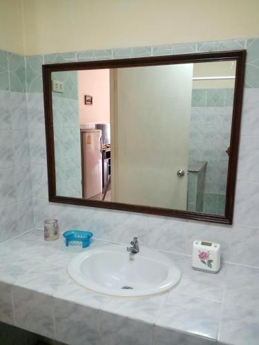a bathroom sink with a large mirror above it at View Talay 1B by Fernando in Pattaya South