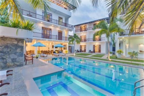 Bazén v ubytování Olu Ayurveda Beach Resort nebo v jeho okolí