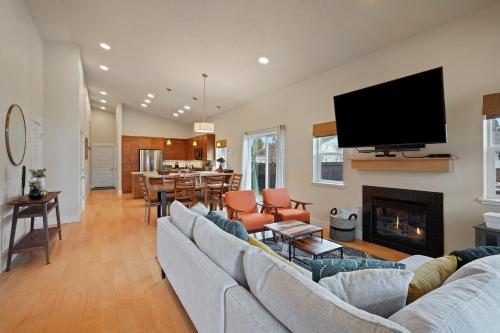 a living room with a couch and a fireplace at Dwell 30 Day Minimum in Bend