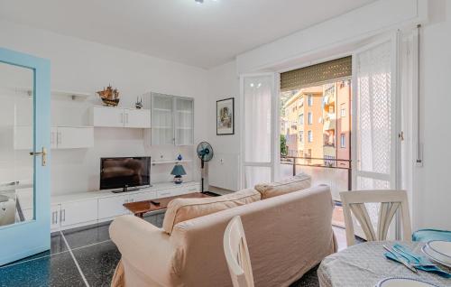 a living room with a couch and a television at 1 Bedroom Beautiful Apartment In Recco in Recco