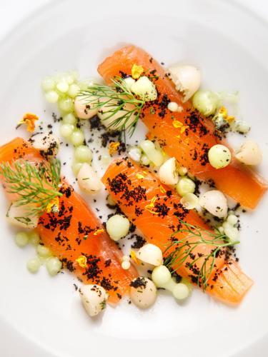 a plate of food with carrots and peas at I Portici Hotel Bologna in Bologna