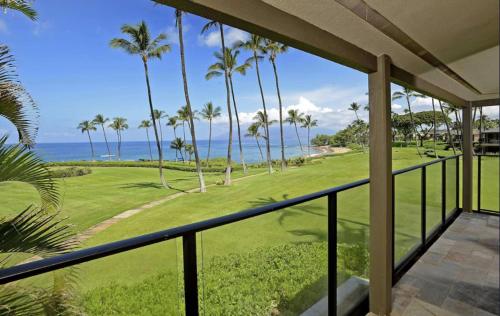 a view of the ocean from the balcony of a house at Wailea Elua Resort 1904 in Wailea