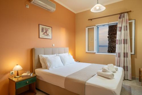 Postel nebo postele na pokoji v ubytování Eleftheria Apartments