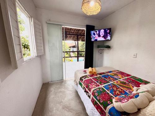 Una cama o camas en una habitación de Suíte 5 - Village Capixaba