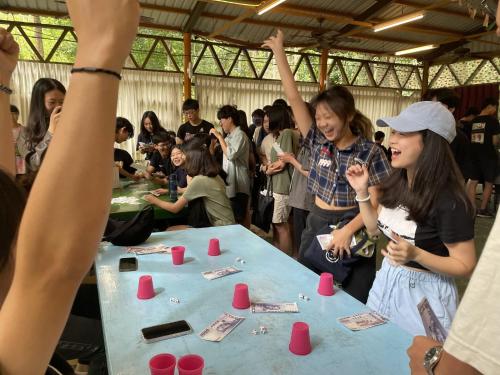 a group of people standing around a table with cups at 森霖旅宿 in Meinong