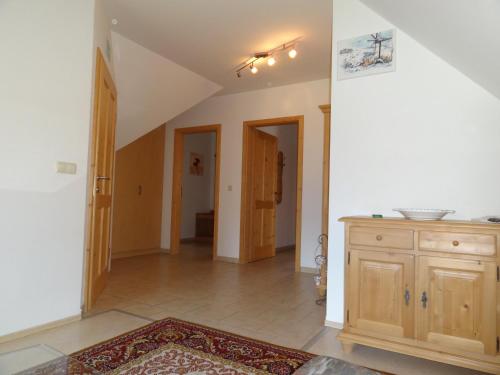 a living room with a staircase and an open hallway at Ferienhaus Zotter in Feldbach