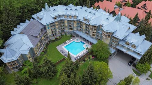 an aerial view of a large building with a swimming pool at Mid Century Modern - Studio w Pool & Hot Tub in Whistler