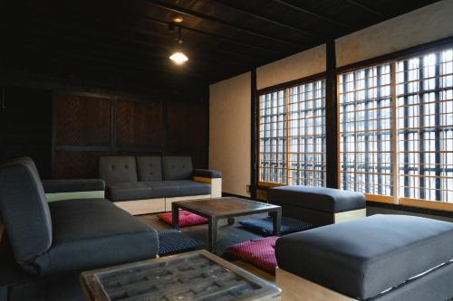 a waiting room with couches and a table and windows at Hanedano Workspace - Vacation STAY 47594v in Nagawa