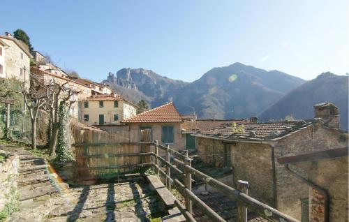 an old town with buildings and mountains in the background at 3 Bedroom Nice Apartment In Stazzema in Stazzema