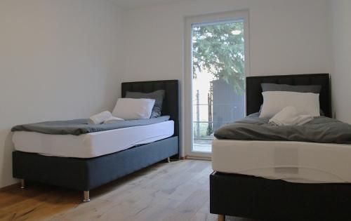Postel nebo postele na pokoji v ubytování Melange Apartments