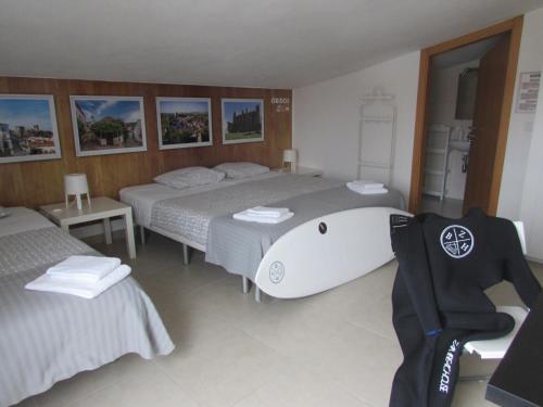 Postel nebo postele na pokoji v ubytování Zambeachouse - Hostel Paradise