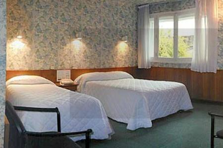 Ένα ή περισσότερα κρεβάτια σε δωμάτιο στο Hôtel du Sablar