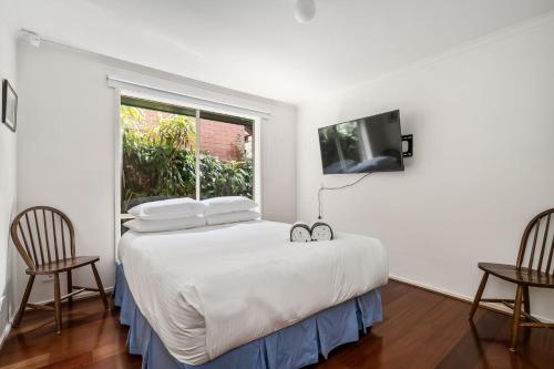 Ένα ή περισσότερα κρεβάτια σε δωμάτιο στο Common Occurrence - Perfectly Positioned in Mile End