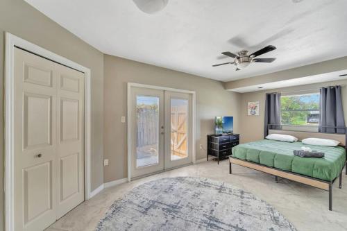 a bedroom with a bed and a ceiling fan at Cozy Private Rm Near Beach Travelers Welcome J1A shared home in Sarasota