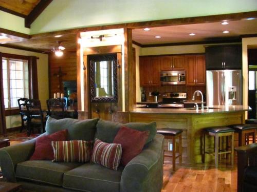a living room with a couch and a kitchen at The Preserve, Craftsman Special Vacation Home by F in Sampson