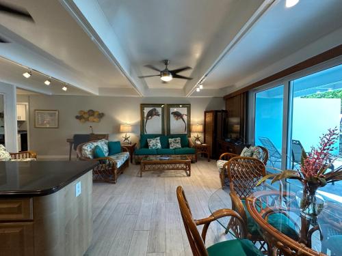 a living room with a couch and a table at Secret Harbour Beach Resort in St Thomas