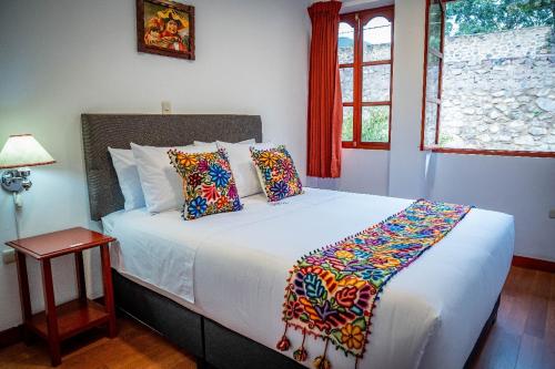 Postel nebo postele na pokoji v ubytování Valle Mistico Hotel Boutique