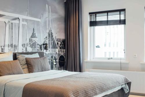 a bedroom with a large bed with a disney mural at Aan de Veste in Enkhuizen
