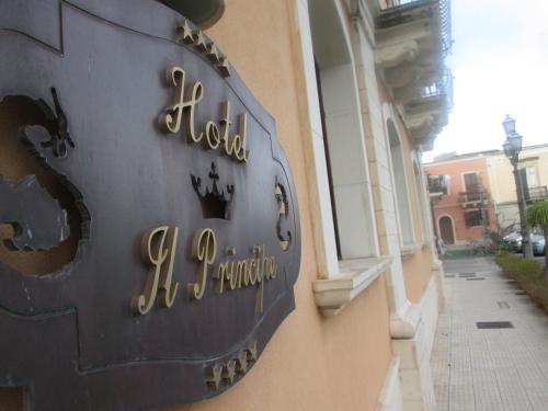 a sign for a hotel on the side of a building at Hotel Il Principe in Milazzo