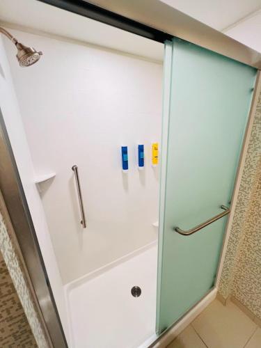 a shower with a glass door in a bathroom at Home2 Suites By Hilton Pensacola Airport Medical Center in Pensacola