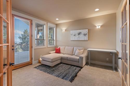 a living room with a couch and a window at Lucy Lou 30 Day Minimum in Bend