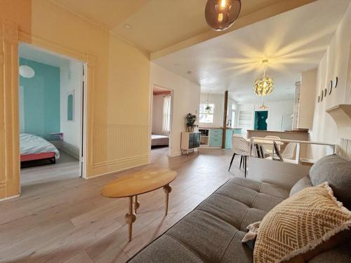 a living room with a couch and a table at Bright and spacious appartment in Montreal