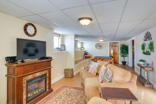 a living room with a fireplace and a couch at Red Rock Rentals in Cannonville