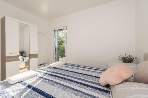 Postel nebo postele na pokoji v ubytování Apartments Cozy