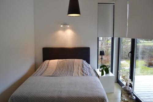Кровать или кровати в номере Härmati Holiday House