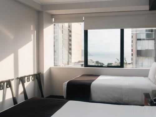 Cama o camas de una habitación en Hotel Ferré Miraflores