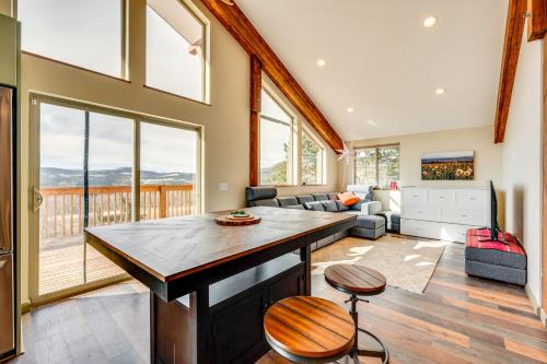 a kitchen with a large island in a living room at 3 Mi to Casinos Cabin with Stables in Black Hawk! in Black Hawk