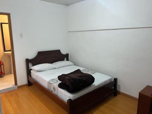 Postel nebo postele na pokoji v ubytování Hostal Casa Primavera