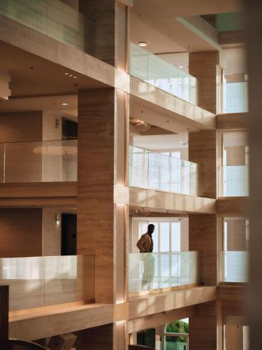 a man looking out the window of a building at Regent Santa Monica Beach in Los Angeles