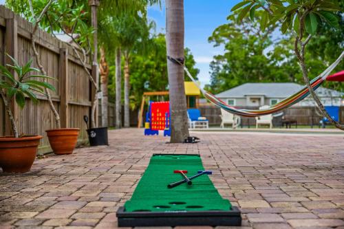 a green track with two pairs of scissors on it at Tropical Oasis- Pickleball, Pool, Hot Tub- 15 min to beach in Melbourne