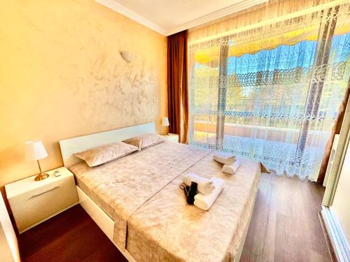 Ένα ή περισσότερα κρεβάτια σε δωμάτιο στο Sea Sun Holiday Apartments