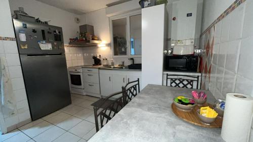 Kuchyň nebo kuchyňský kout v ubytování Chambre chez l'habitant - Parenthèse Bien être - Près de Paul Sabatier