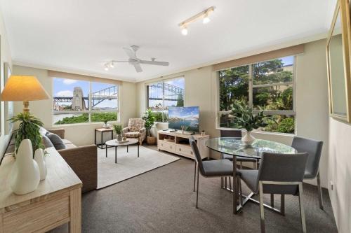 a living room with a table and a couch at Harbourside 10 in Sydney
