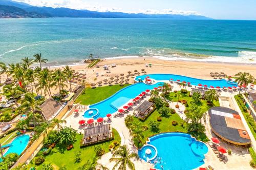 an aerial view of a resort with a beach at Amazing views, beachfront Grand Venetian in Puerto Vallarta