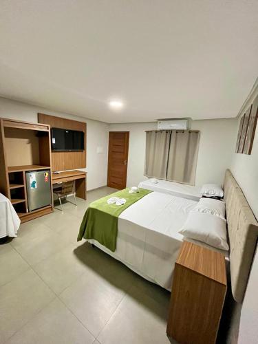 Ένα ή περισσότερα κρεβάτια σε δωμάτιο στο Hotel Pepita