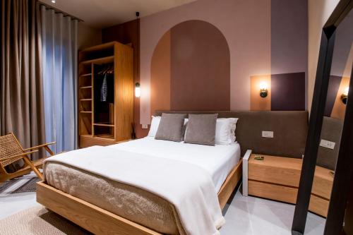 a bedroom with a large bed in a room at Locanda Expanificio in Agrigento