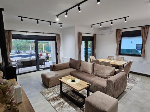 a living room with a couch and a table at Drina Lux in Loznica