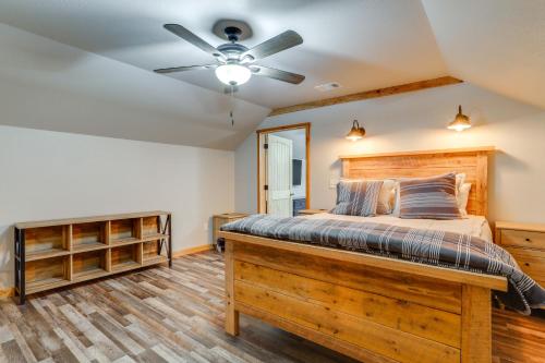 a bedroom with a bed and a ceiling fan at Greers Ferry Lake Access and Deck Group Getaway! in Heber Springs