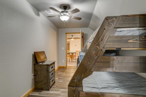 a bedroom with a bunk bed and a ceiling at Greers Ferry Lake Access and Deck Group Getaway! in Heber Springs