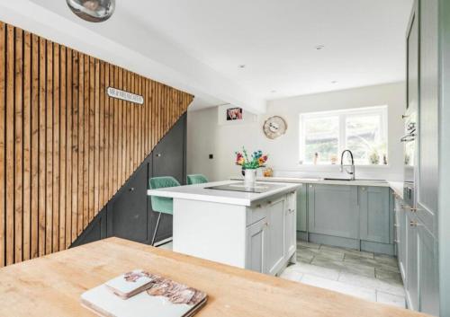 a kitchen with a sink and a counter top at April Cottage in Bacton