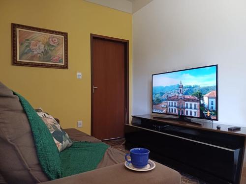 Un televizor și/sau centru de divertisment la Recanto Vila Rica