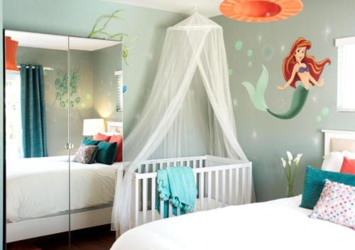 a childs bedroom with a mermaid wall mural at MagicwayVillas Paradise Pier Home - Across Disney in Anaheim