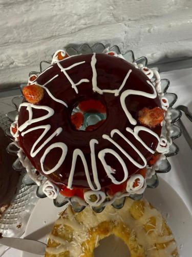 a chocolate covered donut sitting on a plate at Pousada Vila Italia - Porto da Dunas in Aquiraz